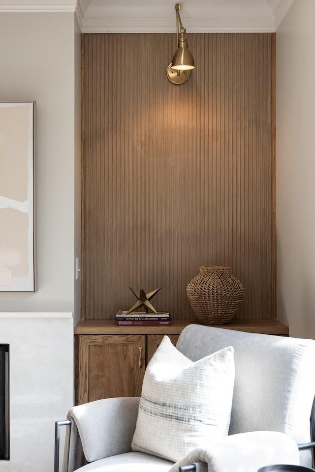 sitting room featuring ornamental molding