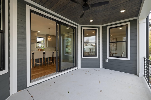 view of patio featuring ceiling fan