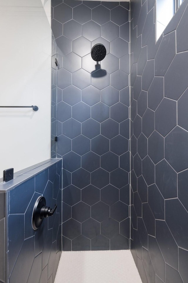 bathroom with tiled shower