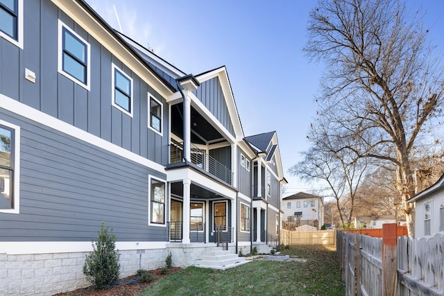 view of side of home featuring a balcony