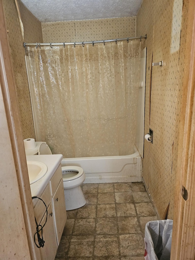 full bathroom with vanity, a textured ceiling, toilet, and shower / bathtub combination with curtain