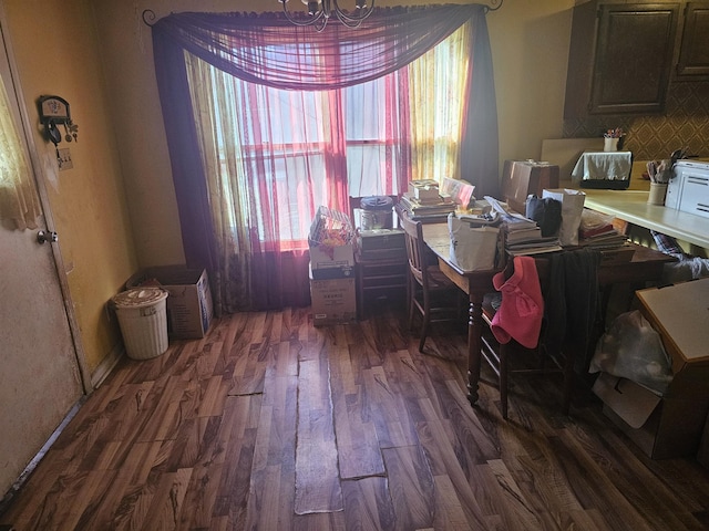 dining room with a chandelier and dark hardwood / wood-style floors