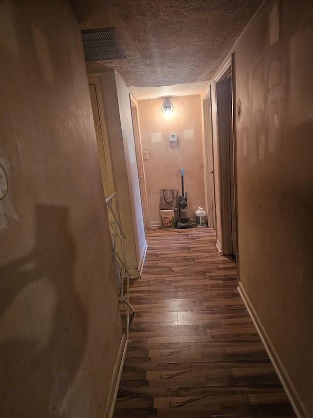 hallway featuring dark hardwood / wood-style floors