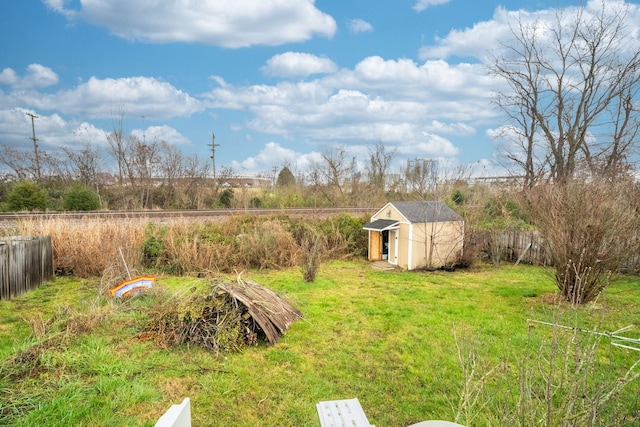 view of yard featuring a storage unit and a rural view