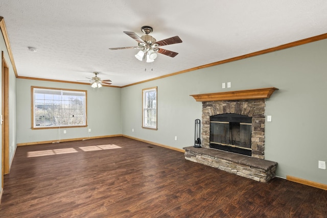 unfurnished living room with dark hardwood / wood-style floors, a healthy amount of sunlight, ornamental molding, and a fireplace