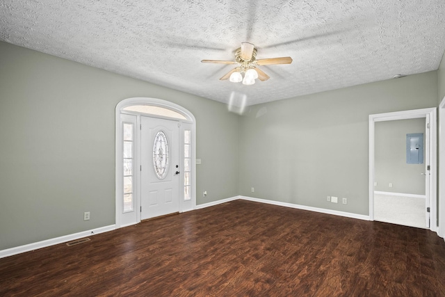 entrance foyer featuring a textured ceiling, dark hardwood / wood-style flooring, electric panel, and ceiling fan