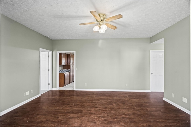 spare room with ceiling fan, wood-type flooring, and a textured ceiling