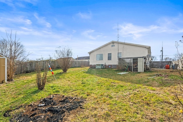 back of property featuring a yard and cooling unit