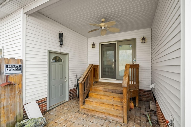 entrance to property featuring ceiling fan