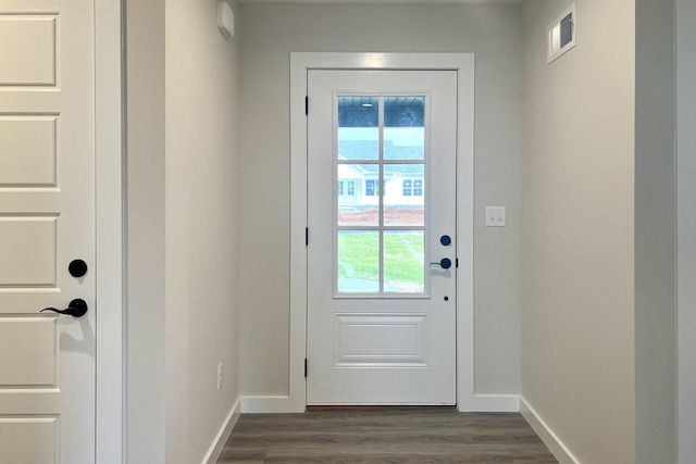 doorway with dark wood-type flooring