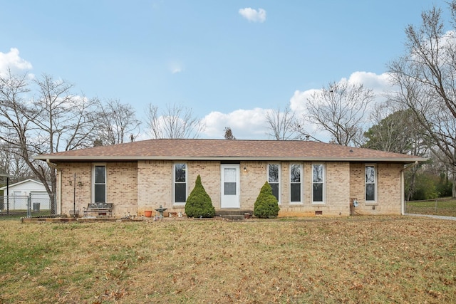 ranch-style home with a front lawn