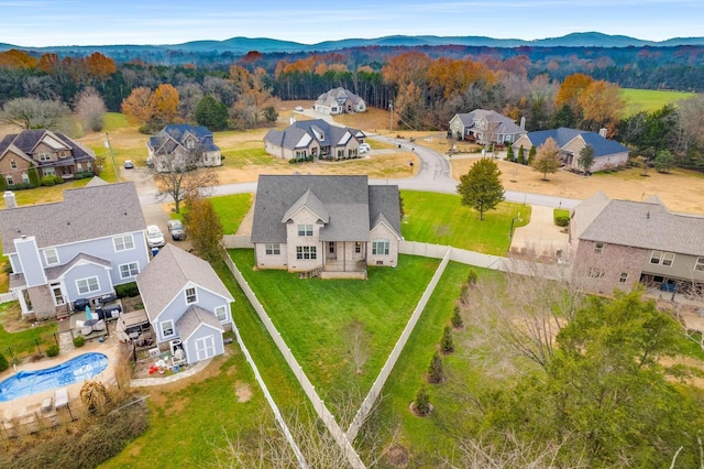 birds eye view of property with a mountain view