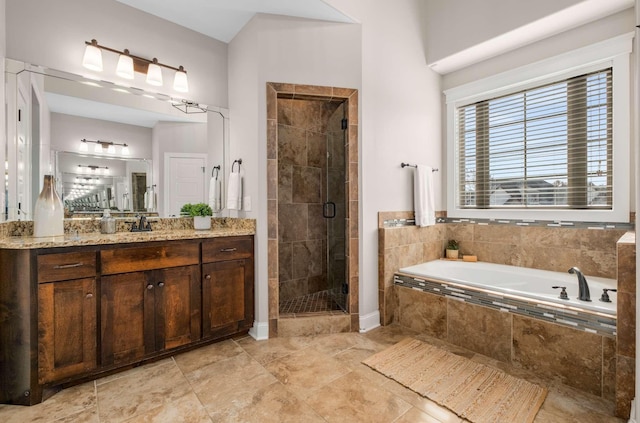 bathroom featuring plus walk in shower and vanity