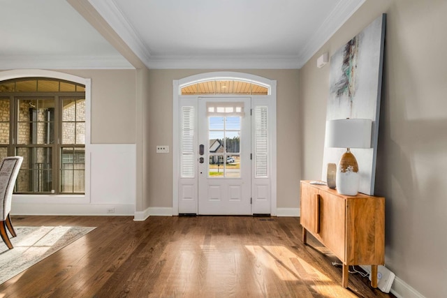 entrance foyer with hardwood / wood-style floors and ornamental molding