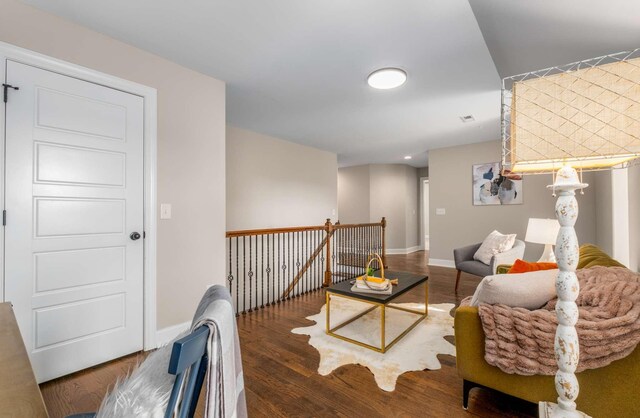 living room featuring dark wood-type flooring