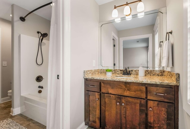 full bathroom featuring vanity, bathtub / shower combination, and toilet