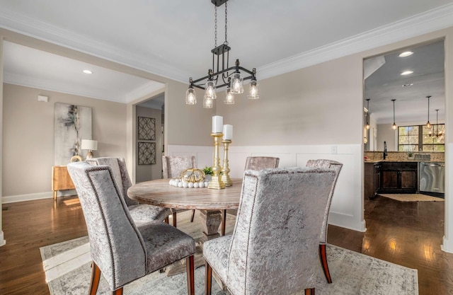 dining space featuring an inviting chandelier, dark wood-type flooring, and ornamental molding