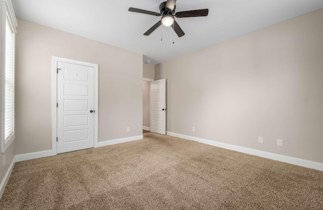 unfurnished bedroom featuring carpet and ceiling fan