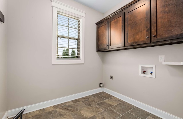 washroom featuring washer hookup, cabinets, and hookup for an electric dryer