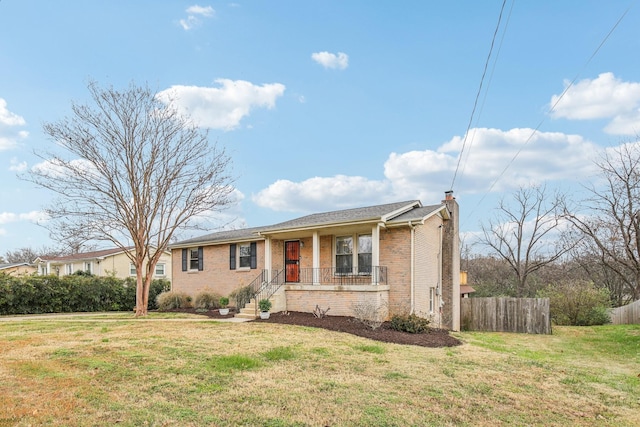 ranch-style house with a front yard and a porch