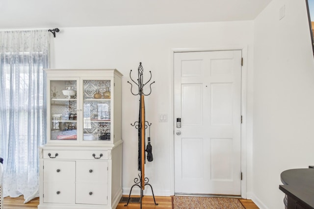 entryway with light hardwood / wood-style floors