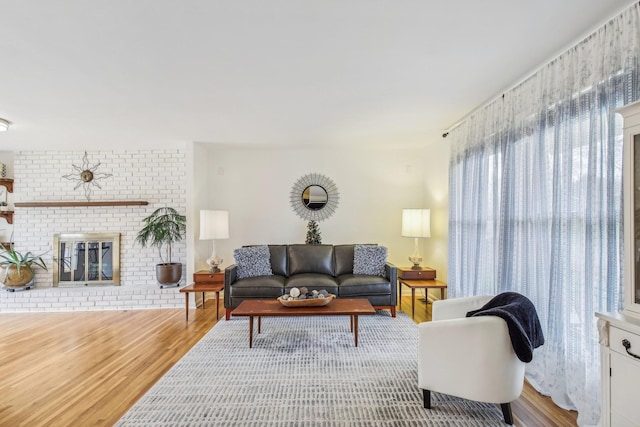 living room featuring a fireplace and hardwood / wood-style flooring