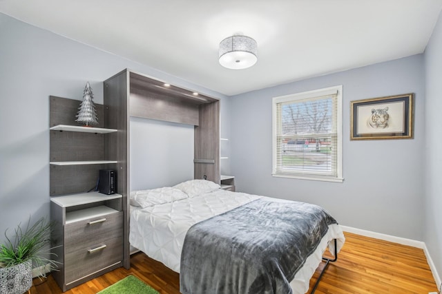 bedroom featuring hardwood / wood-style floors