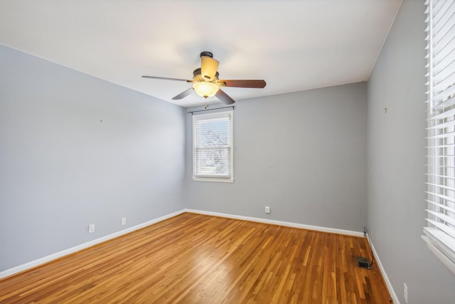 spare room featuring ceiling fan and hardwood / wood-style flooring