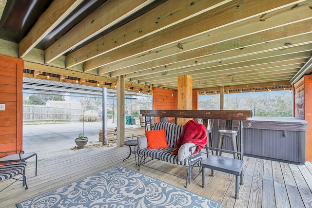 deck featuring a hot tub