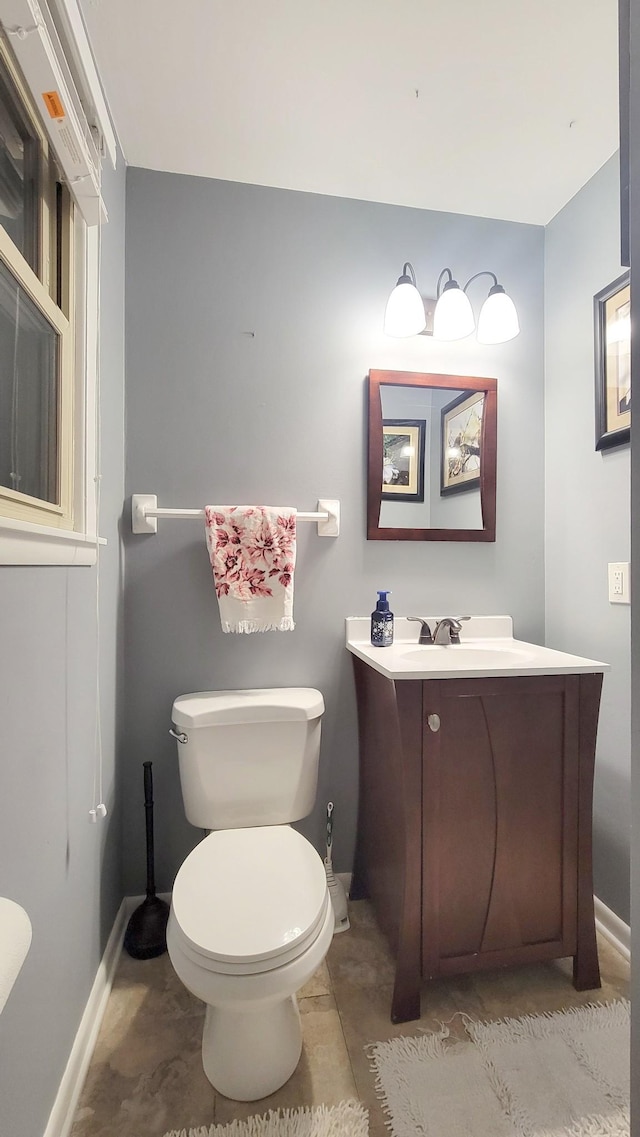 bathroom with tile patterned floors, vanity, and toilet