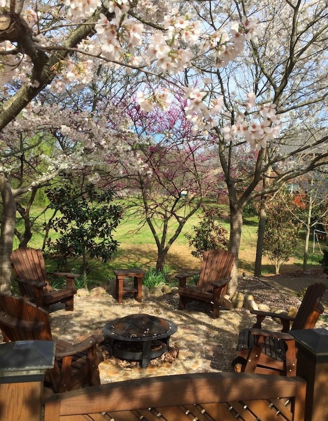 view of patio / terrace featuring an outdoor fire pit