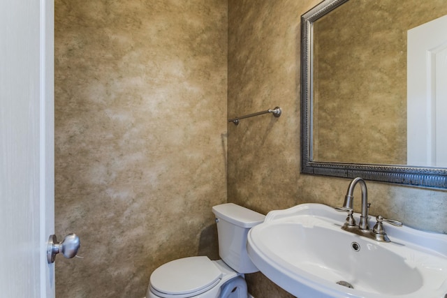 bathroom with sink and toilet