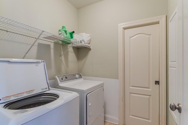 laundry area featuring washing machine and clothes dryer