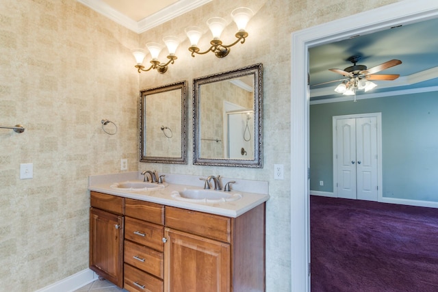 bathroom with ceiling fan, vanity, and ornamental molding