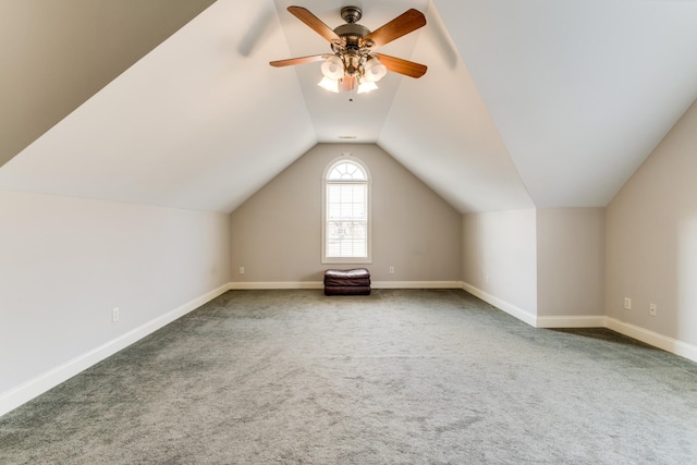 additional living space featuring ceiling fan, carpet floors, and vaulted ceiling