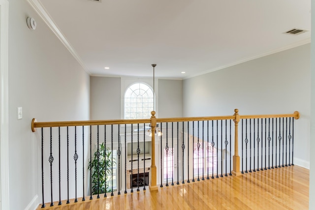 hall with crown molding and hardwood / wood-style floors