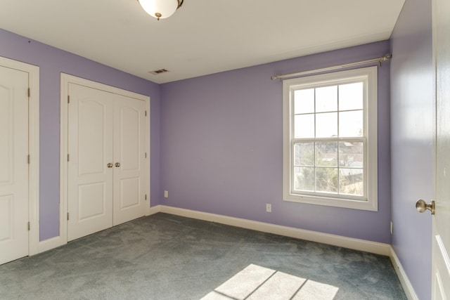 unfurnished bedroom with carpet floors