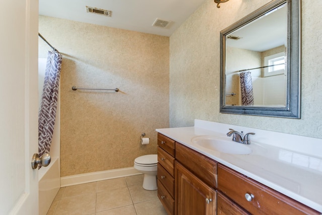 bathroom with tile patterned flooring, a shower with curtain, vanity, and toilet