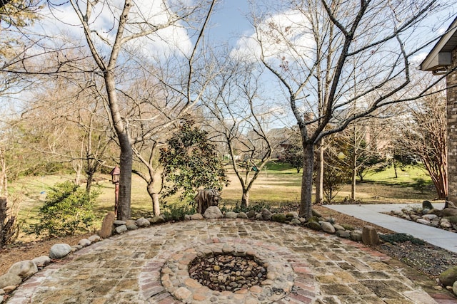 view of patio featuring an outdoor fire pit