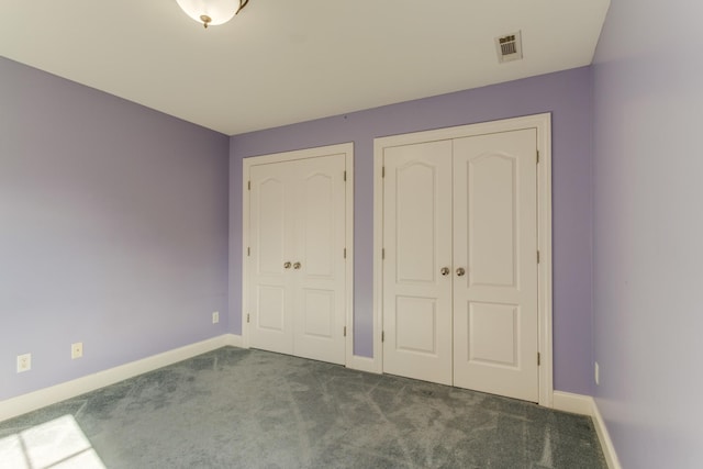 unfurnished bedroom with carpet flooring