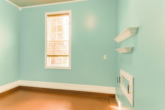 spare room featuring crown molding