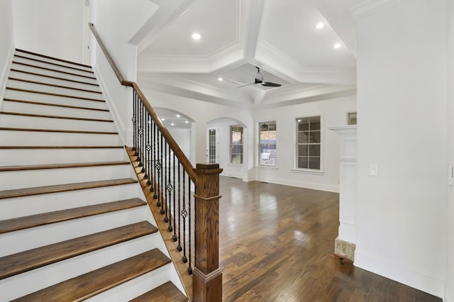 staircase with coffered ceiling, ceiling fan, crown molding, beam ceiling, and hardwood / wood-style floors