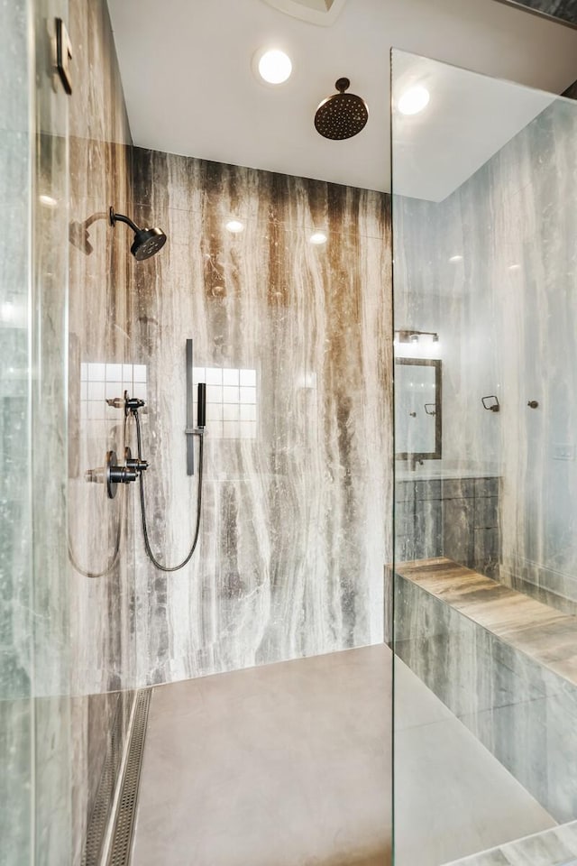 bathroom with tiled shower