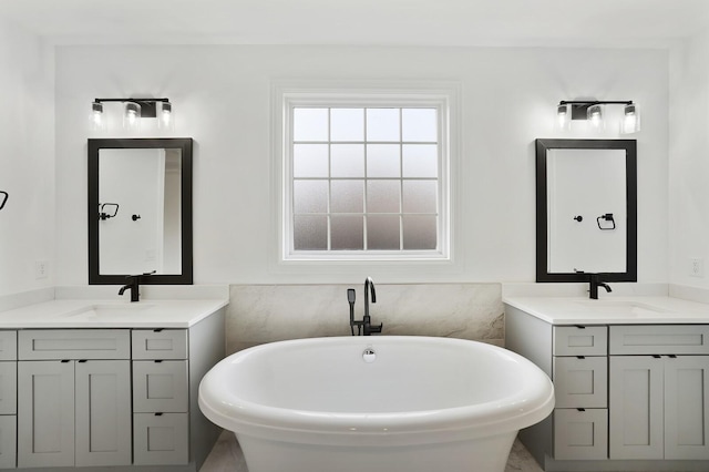 bathroom with a bathing tub and vanity