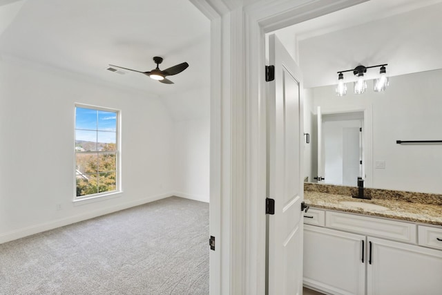 bathroom featuring ceiling fan and vanity