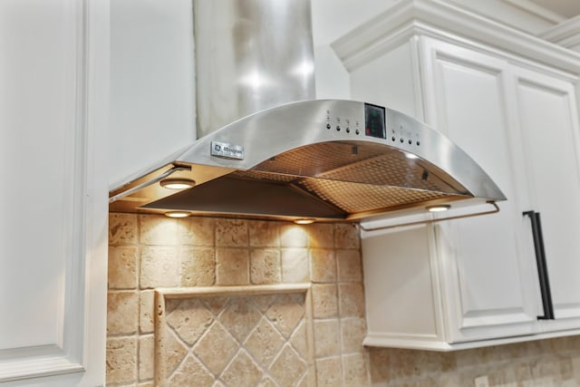 kitchen with decorative backsplash and white cabinetry