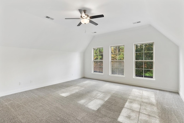 bonus room with carpet flooring, vaulted ceiling, and ceiling fan