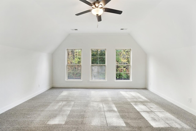 bonus room with ceiling fan, light colored carpet, and vaulted ceiling