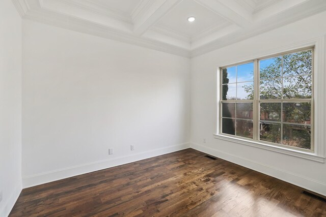 spare room with dark hardwood / wood-style floors, beam ceiling, crown molding, and coffered ceiling