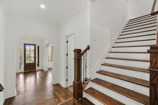 foyer featuring dark hardwood / wood-style floors and ornamental molding